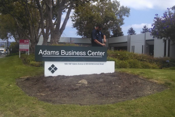 Bennett Graphics installing a monument Sign at Adams Business Center in San Leandro